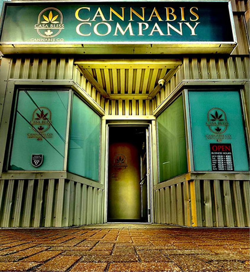 Casa Bliss Cannabis storefront with gold and green signage and an open entrance