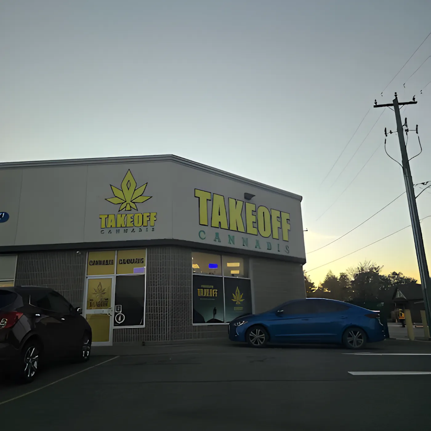 Take Off Cannabis storefront in its Thorold plaza at dusk