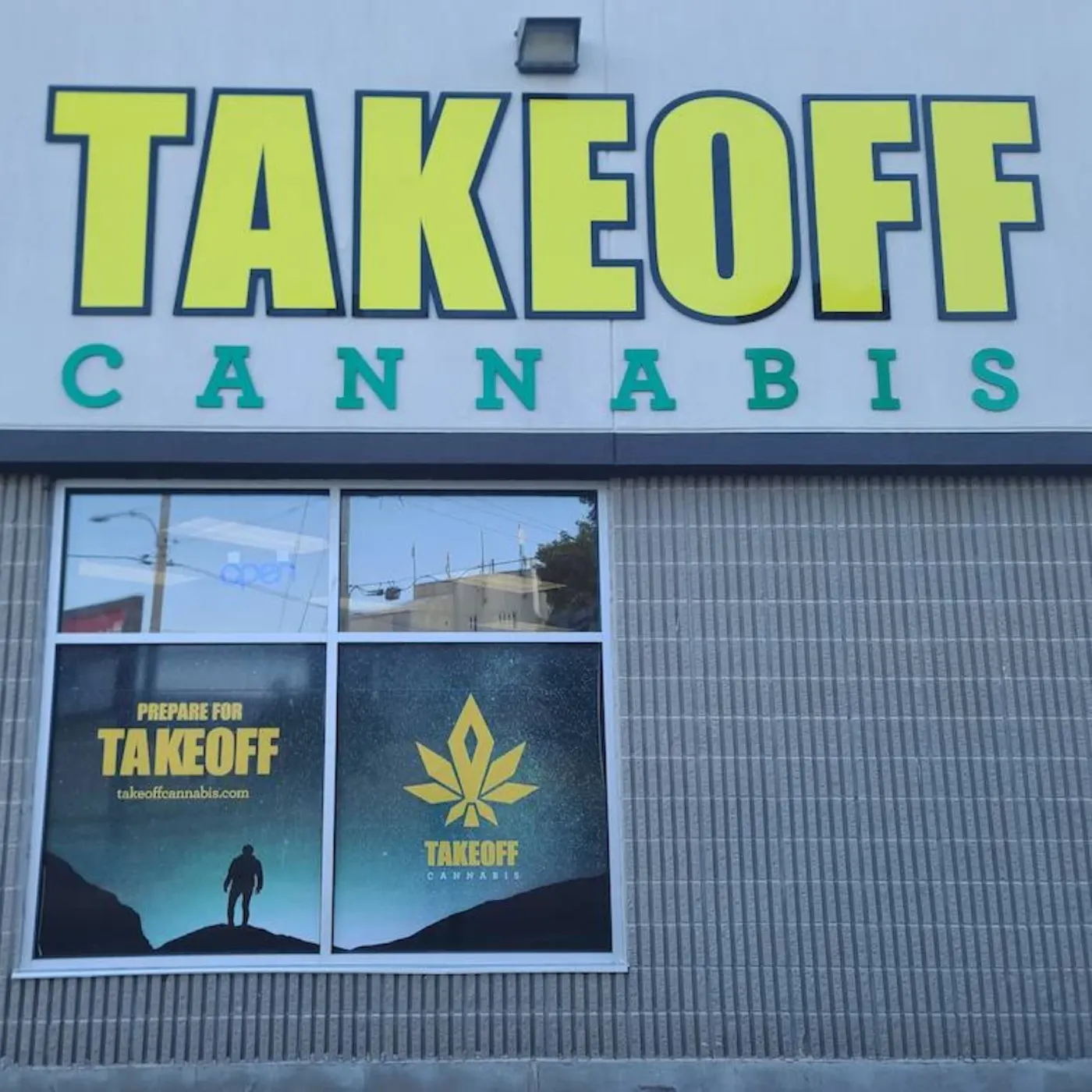 Take Off Cannabis storefront in Thorold, with yellow signage and space-themed window graphics